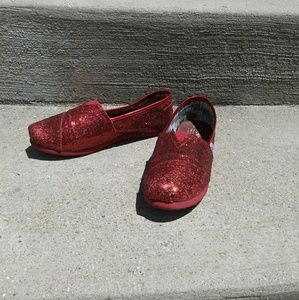 TOMS red sparkly slip ons, size Y4